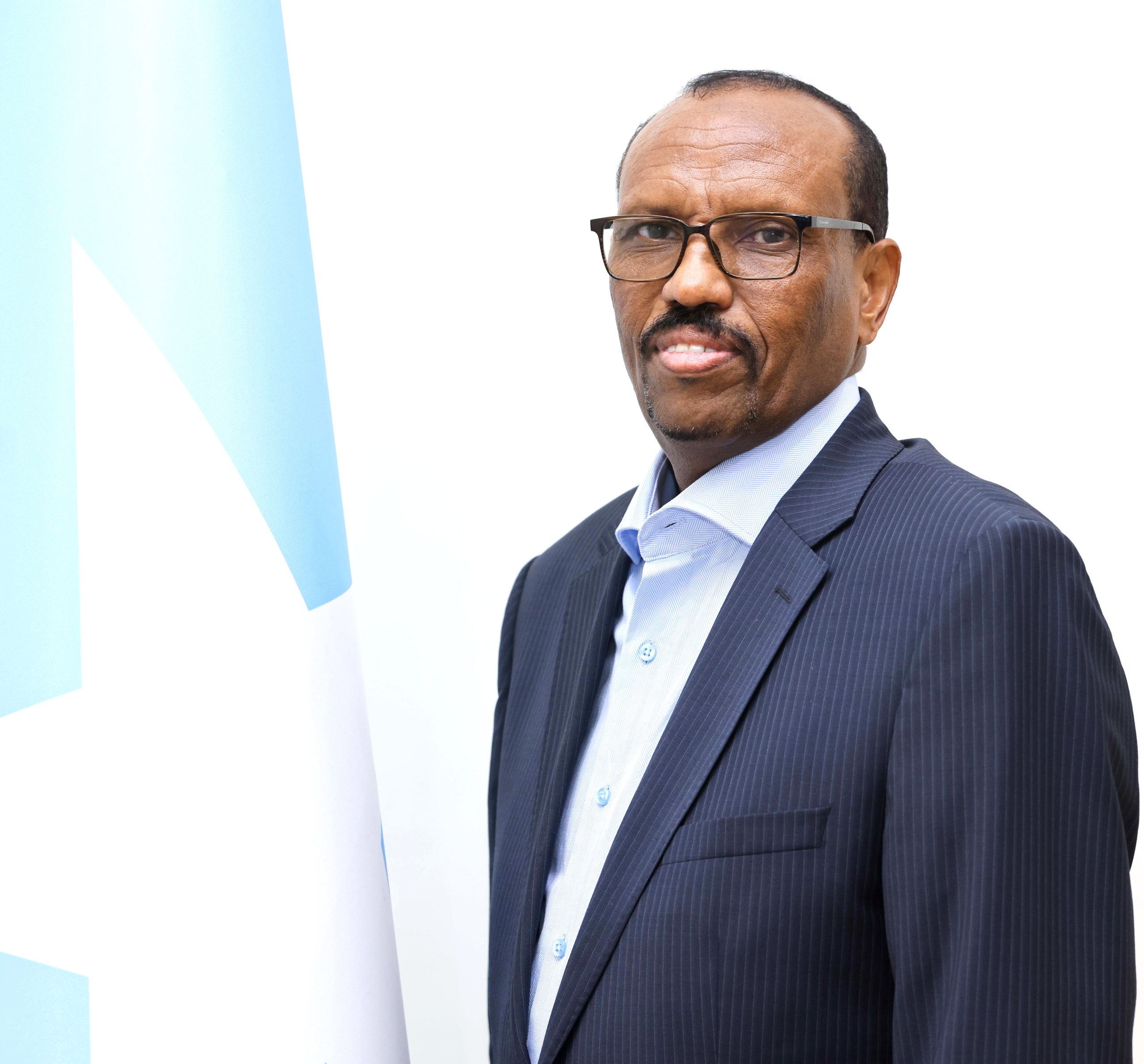 Man wearing suit and glasses